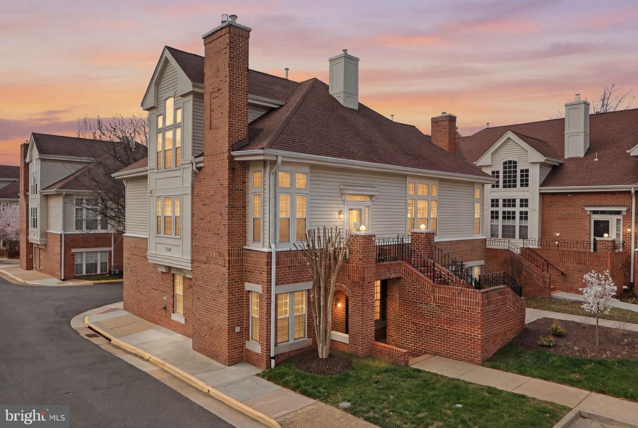 a front view of house with a garden