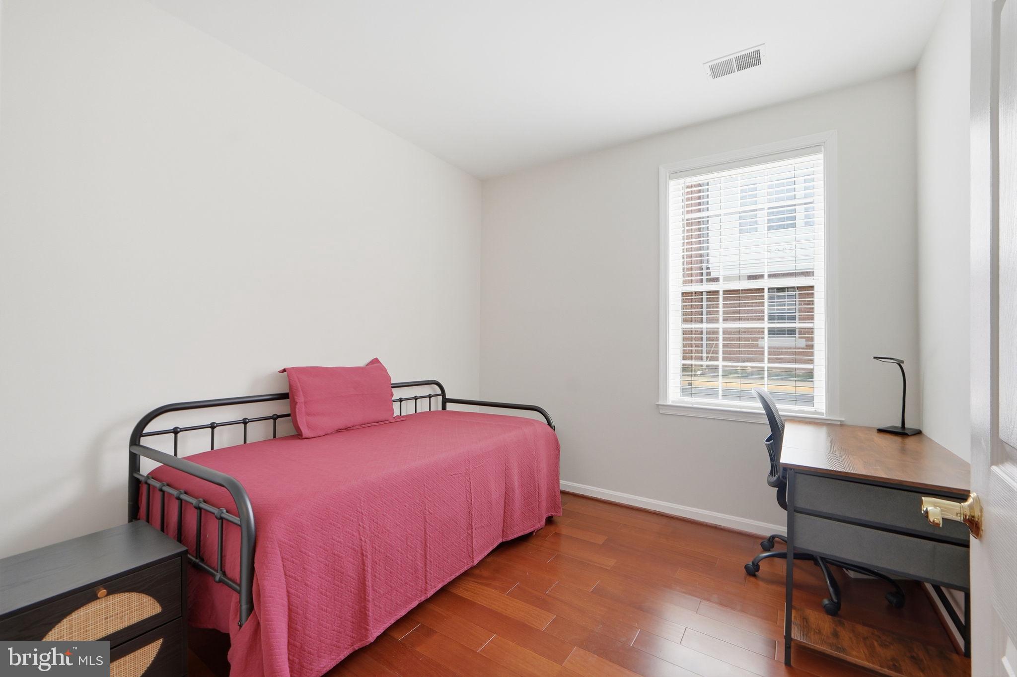 7023 Haycock Road Falls Church, VA 22043 - Photo 13 of 22 a bedroom with a bed and a window