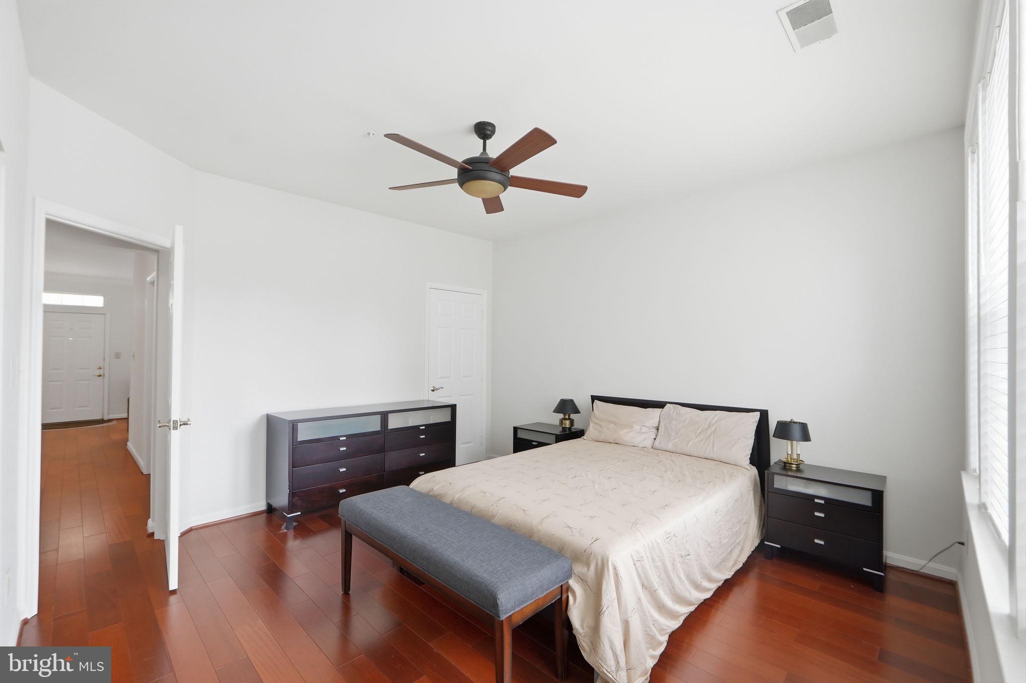 7023 Haycock Road Falls Church, VA 22043 - Photo 17 of 22 a bedroom with a bed and wooden floor