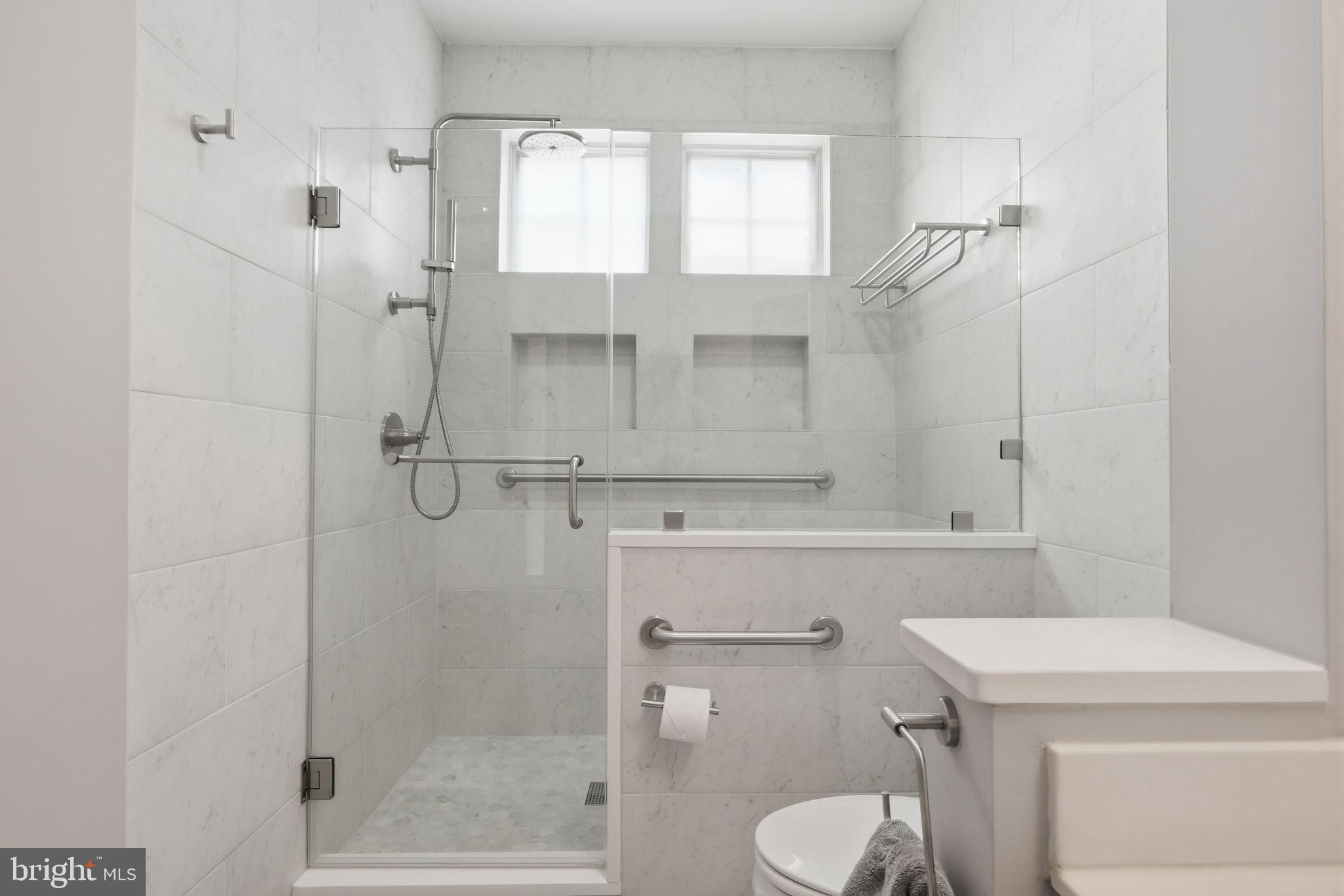 7023 Haycock Road Falls Church, VA 22043 - Photo 19 of 22 a bathroom with a sink a toilet and shower