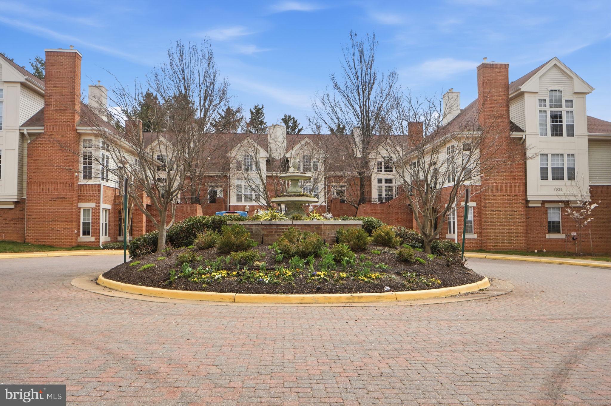 7023 Haycock Road Falls Church, VA 22043 - Photo 22 of 22 a tall building with trees in front of it