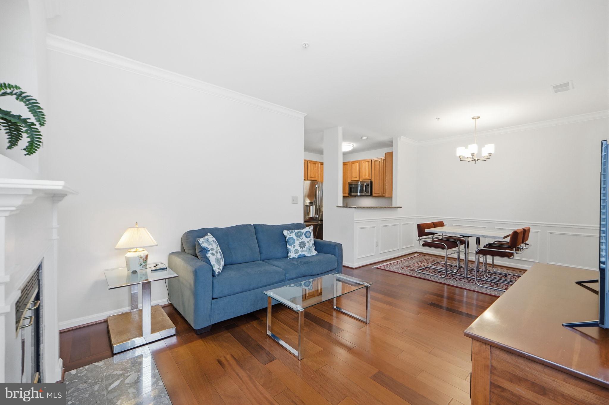 7023 Haycock Road Falls Church, VA 22043 - Photo 6 of 22 a living room with furniture and a wooden floor