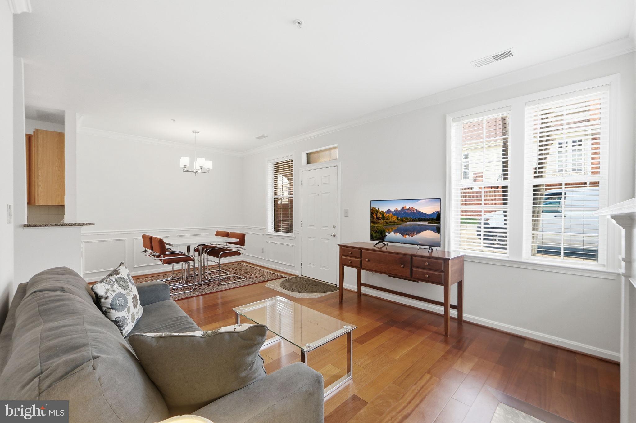 7023 Haycock Road Falls Church, VA 22043 - Photo 7 of 22 a living room with furniture and a flat screen tv