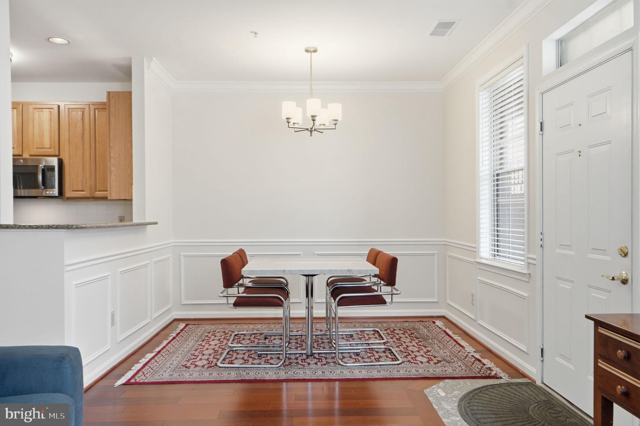 7023 Haycock Road Falls Church, VA 22043 - Photo 8 of 22 a living room with furniture and a rug