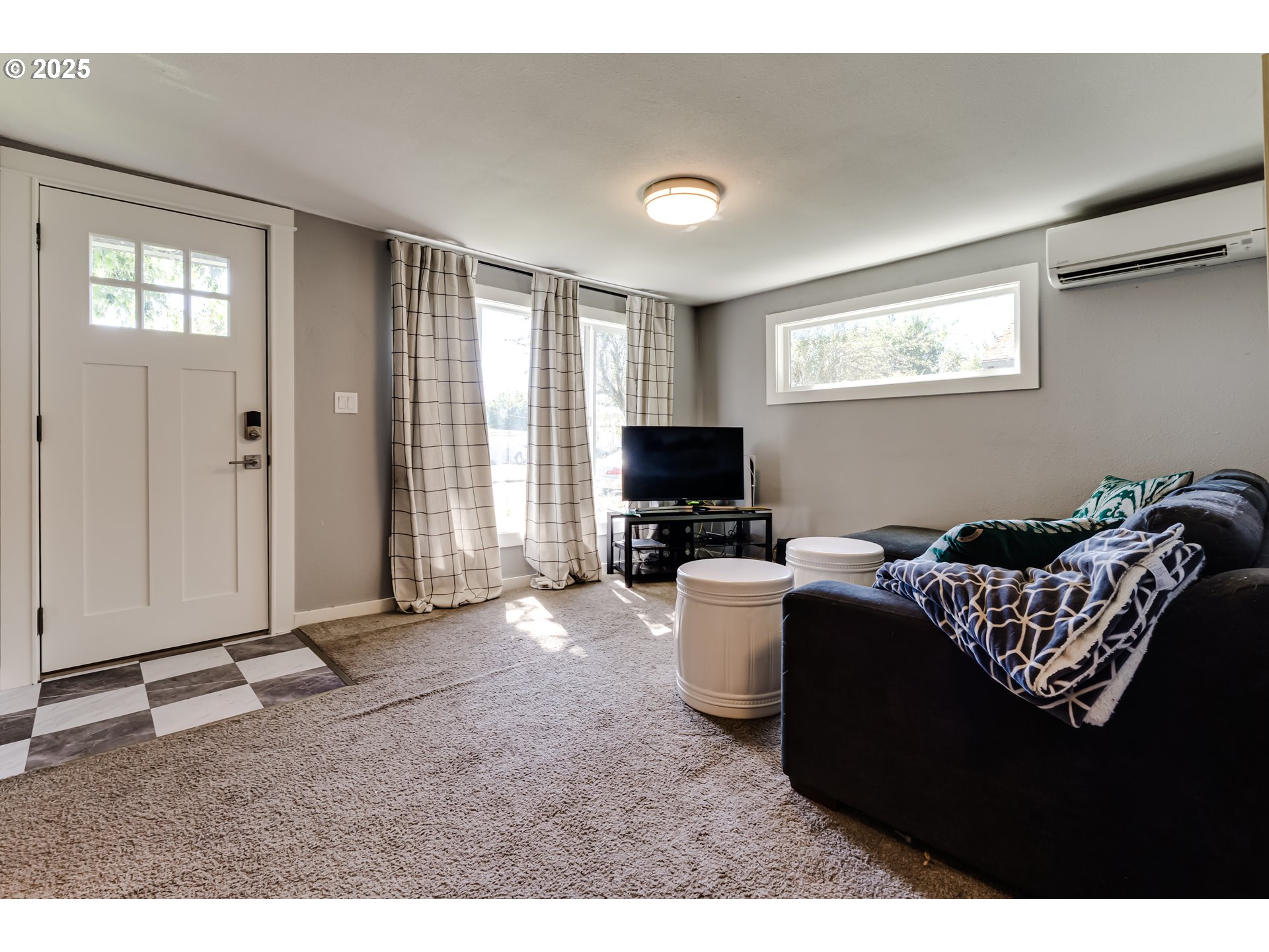 320 26th Street Springfield, OR 97477 - Photo 2 of 24 a living room with furniture a window and a flat screen tv