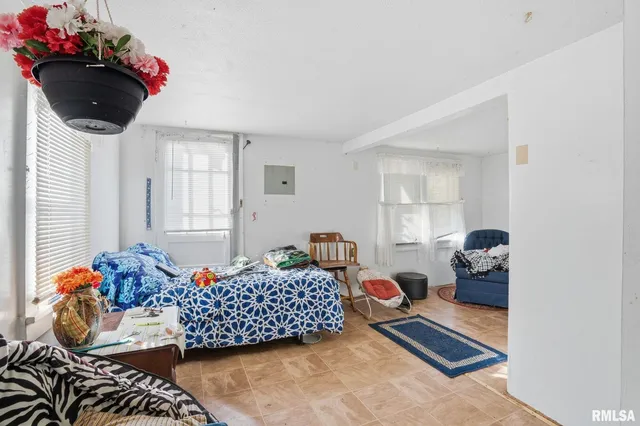 a view of a livingroom with furniture and window