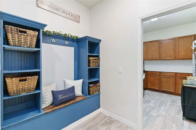 a bedroom with a bed and a ceiling fan