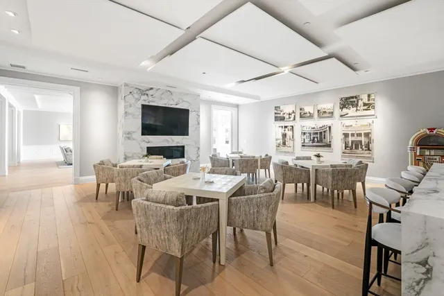 a brick building with a garden in front of it