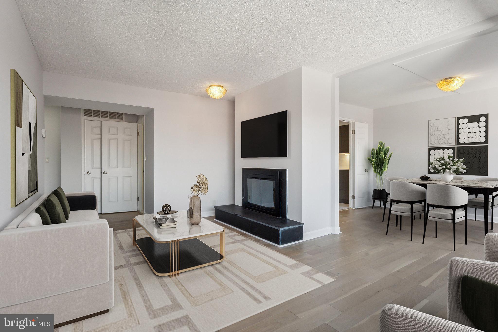 1077 30th Street Northwest, Unit 705 Washington, DC 20007 - Photo 2 of 31 a living room with furniture and a fireplace