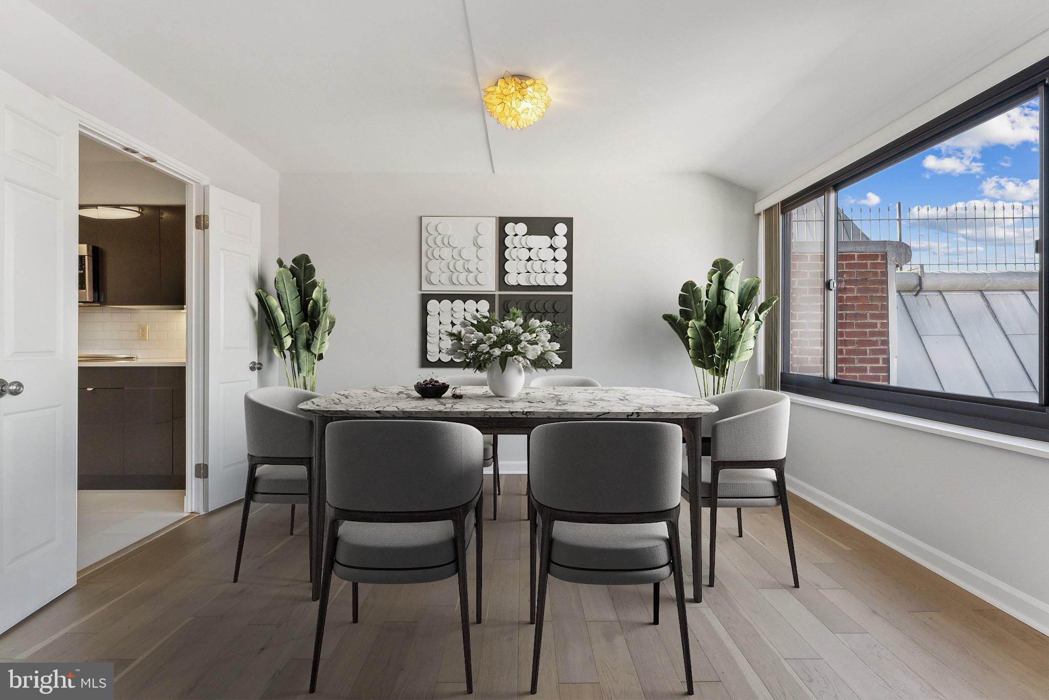 1077 30th Street Northwest, Unit 705 Washington, DC 20007 - Photo 4 of 31 a dining room with furniture and window