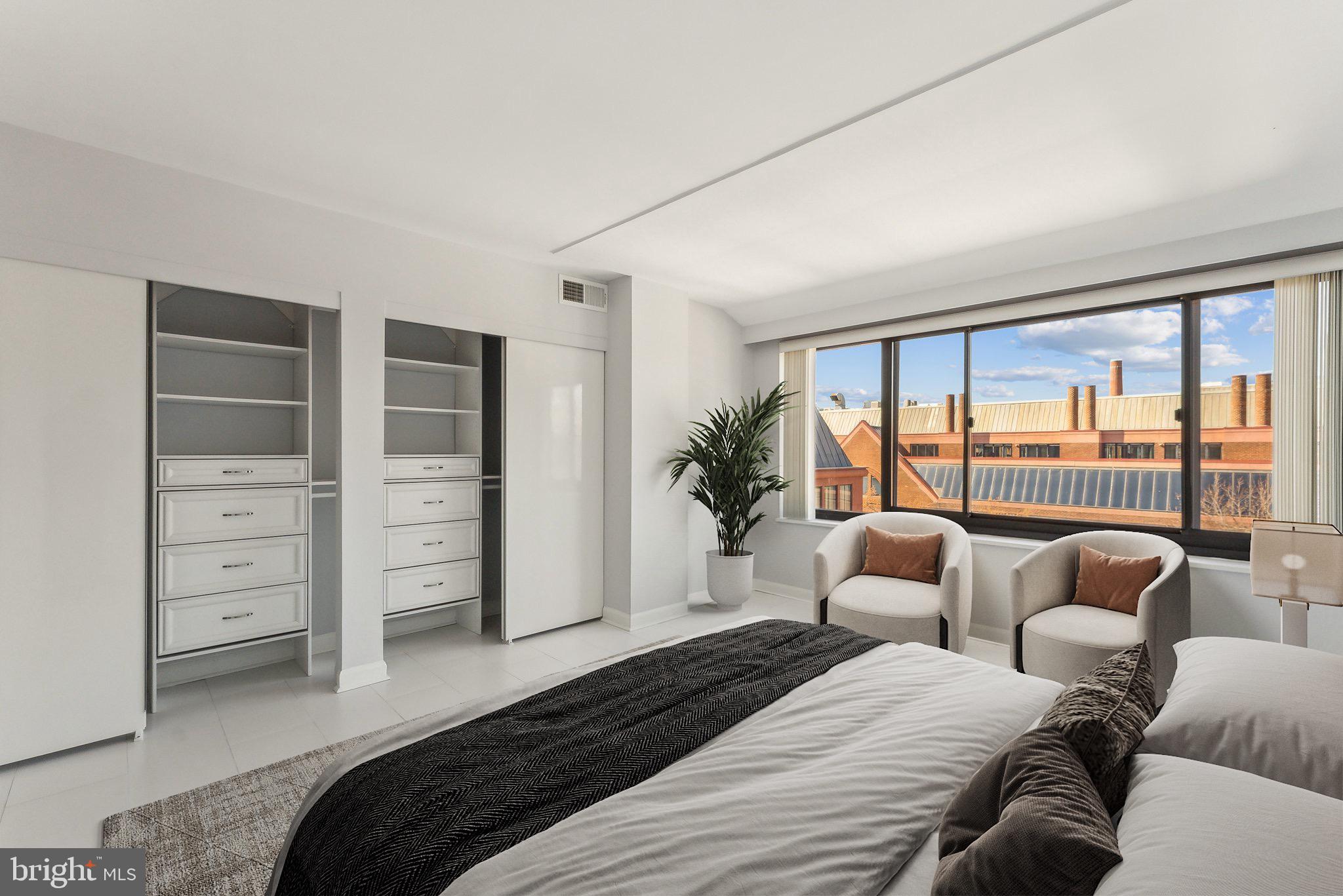 1077 30th Street Northwest, Unit 705 Washington, DC 20007 - Photo 7 of 31 a bedroom with furniture and a large window