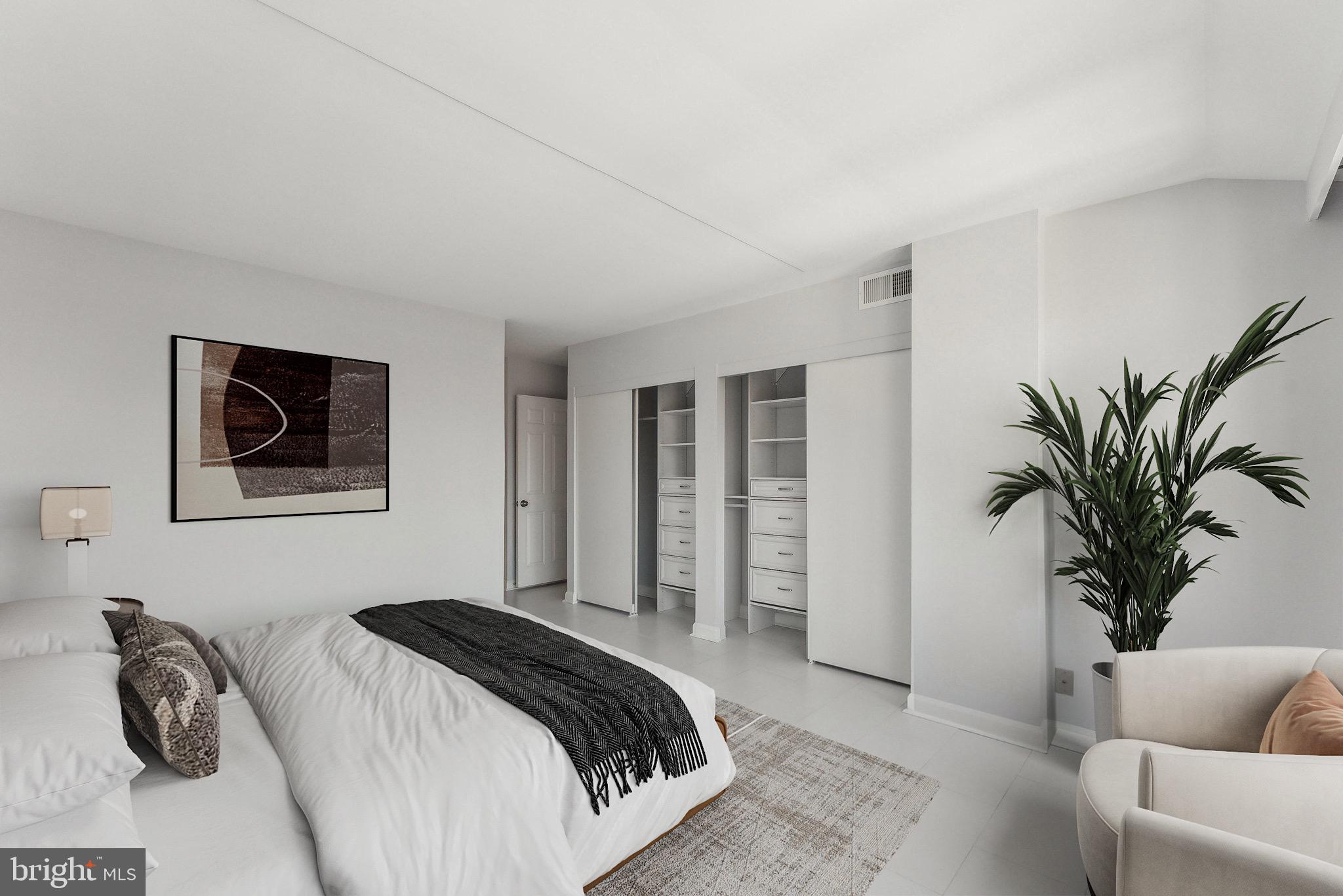 1077 30th Street Northwest, Unit 705 Washington, DC 20007 - Photo 9 of 31 a bedroom with a bed and a couch