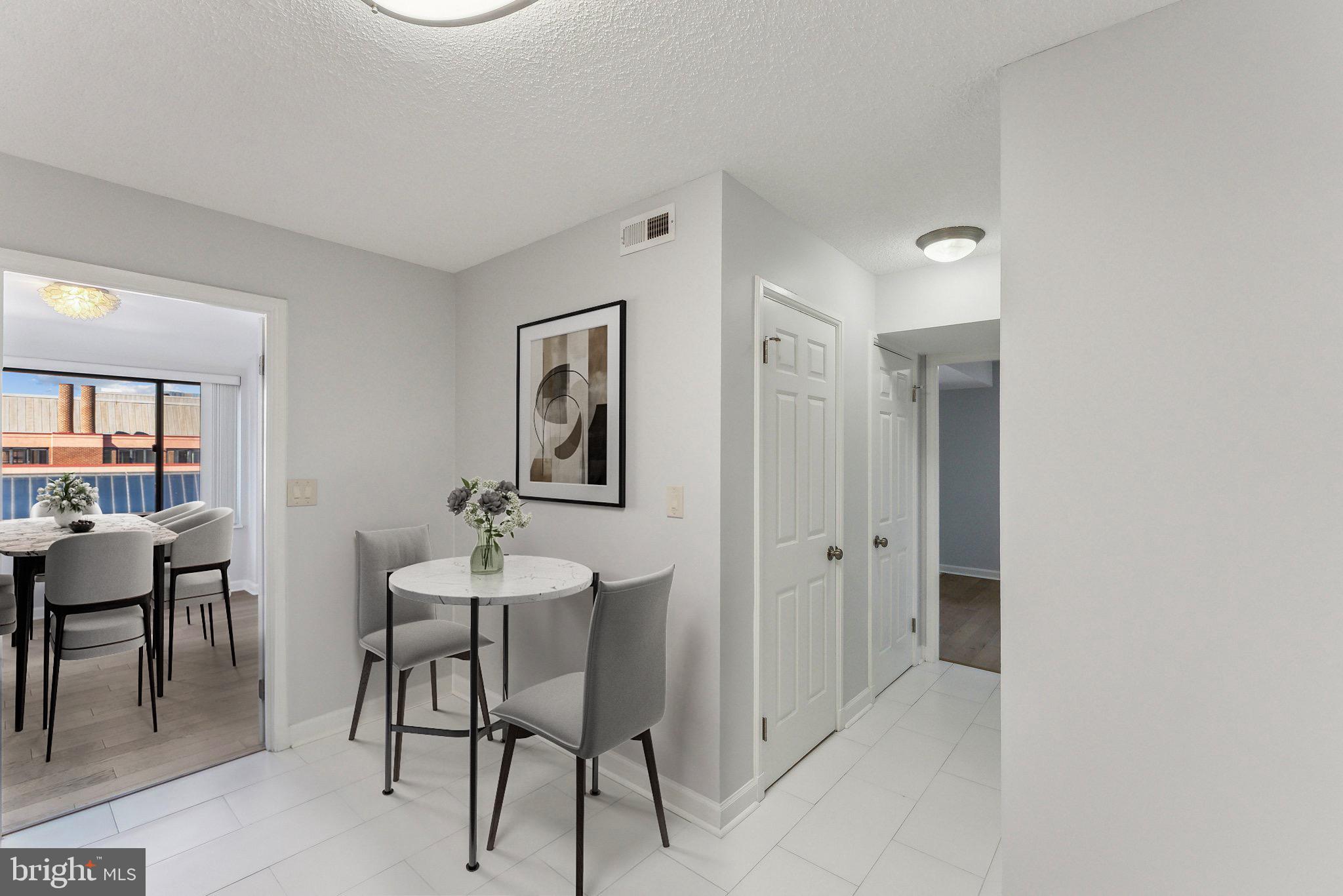 1077 30th Street Northwest, Unit 705 Washington, DC 20007 - Photo 10 of 31 a view of a livingroom with furniture and windows