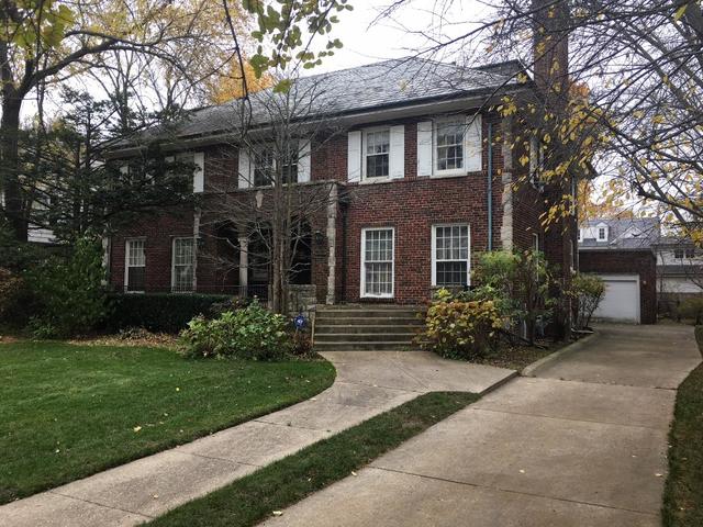 240 Raleigh Road Kenilworth, IL 60043 - Photo 9 of 9 a front view of a house with a garden