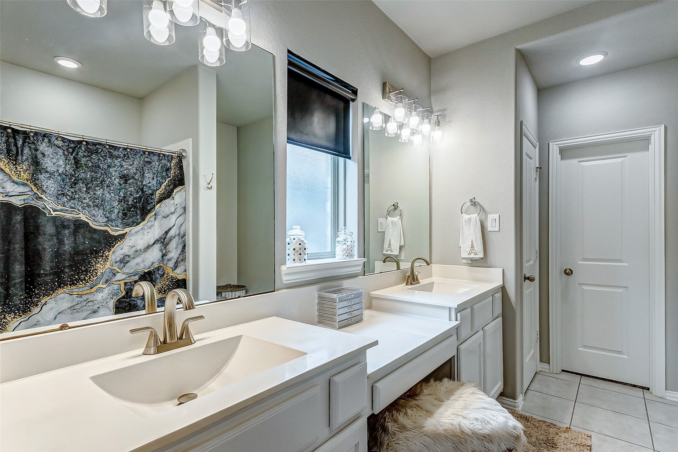7314 Saddle Tree Drive Spring, TX 77379 - Photo 13 of 21 a bathroom with double vanity and a mirror