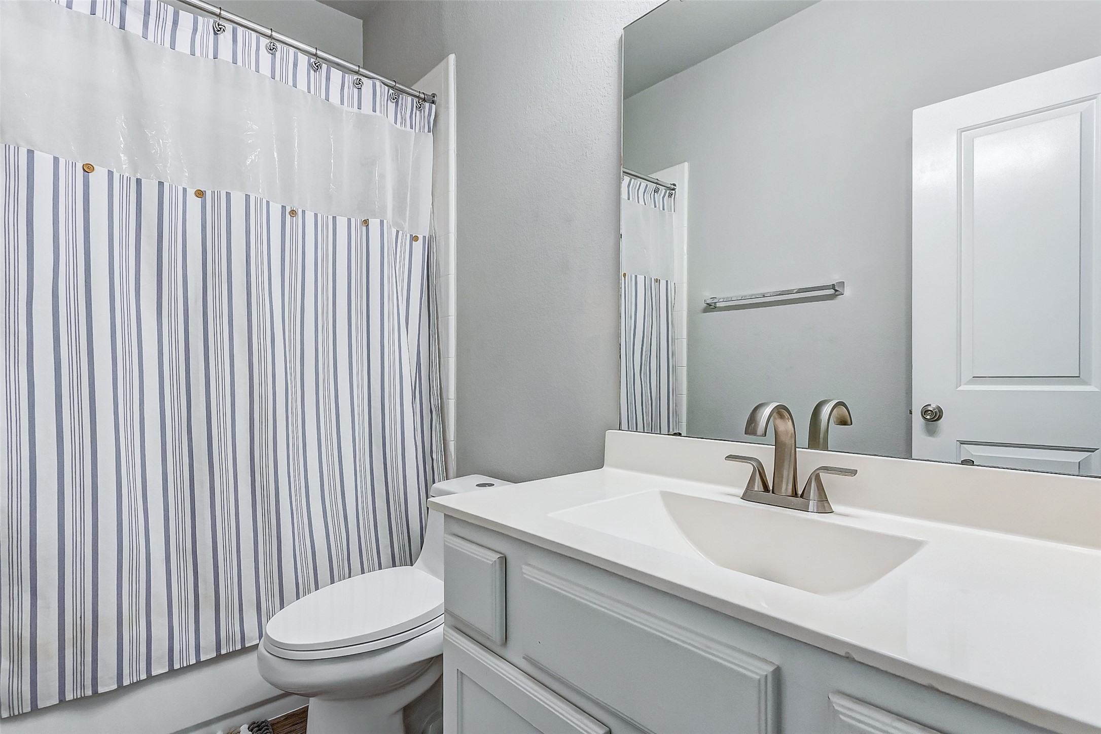 7314 Saddle Tree Drive Spring, TX 77379 - Photo 10 of 21 a bathroom with a sink a toilet and a mirror