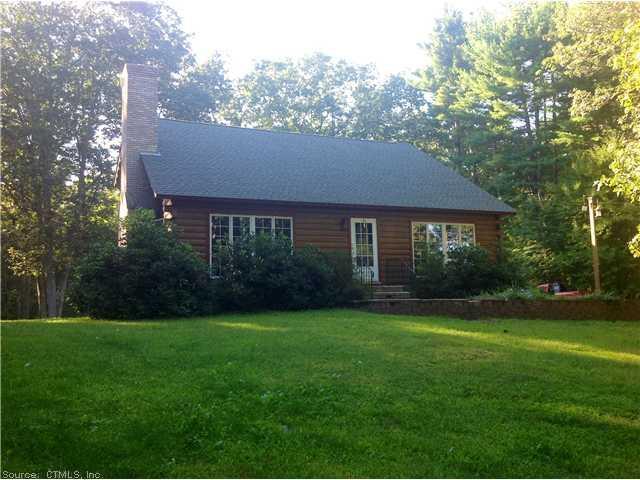 96 Labby Road Thompson, CT 06255 - Photo 1 of 1 a front view of a house with garden