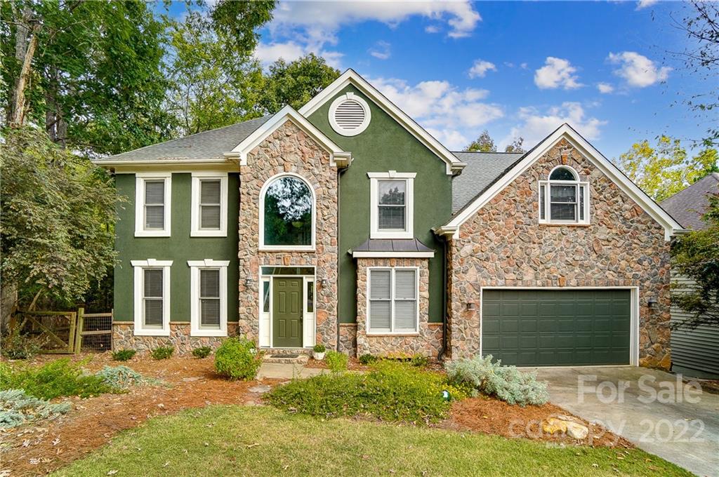 31020 Executive Point Tega Cay, SC 29708 - Photo 1 of 48 a front view of a house with garden