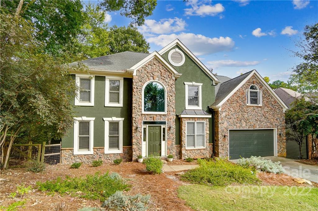 31020 Executive Point Tega Cay, SC 29708 - Photo 2 of 48 a front view of a house with a yard