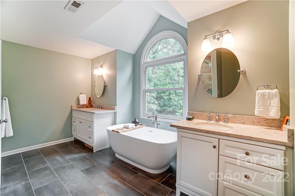 31020 Executive Point Tega Cay, SC 29708 - Photo 23 of 48 a bathroom with a sink and a mirror