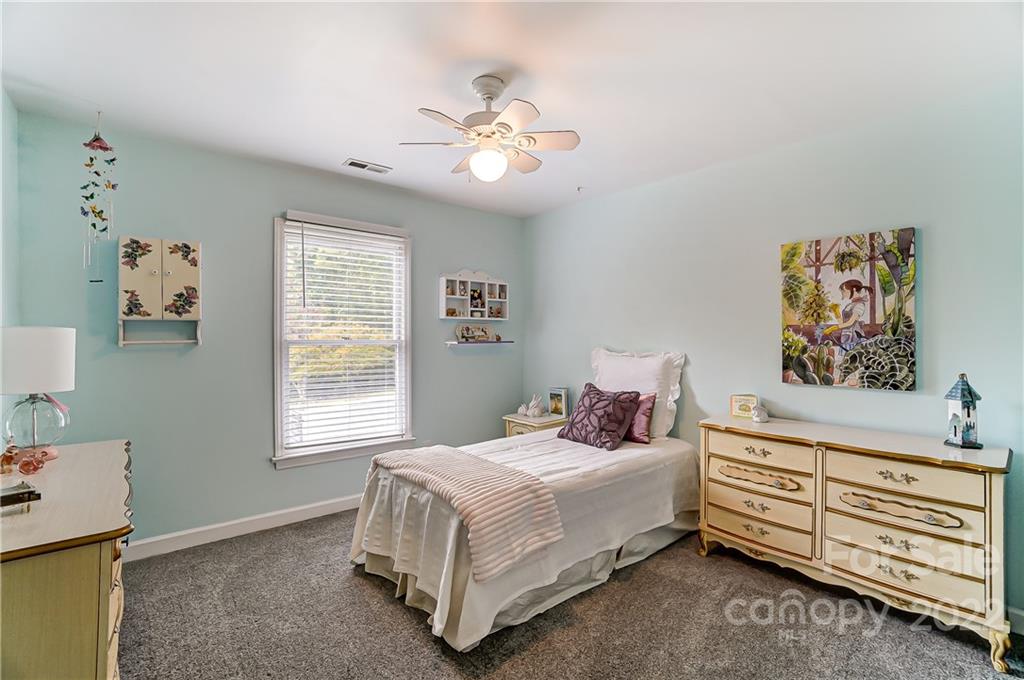 31020 Executive Point Tega Cay, SC 29708 - Photo 28 of 48 a bedroom with a bed and a window