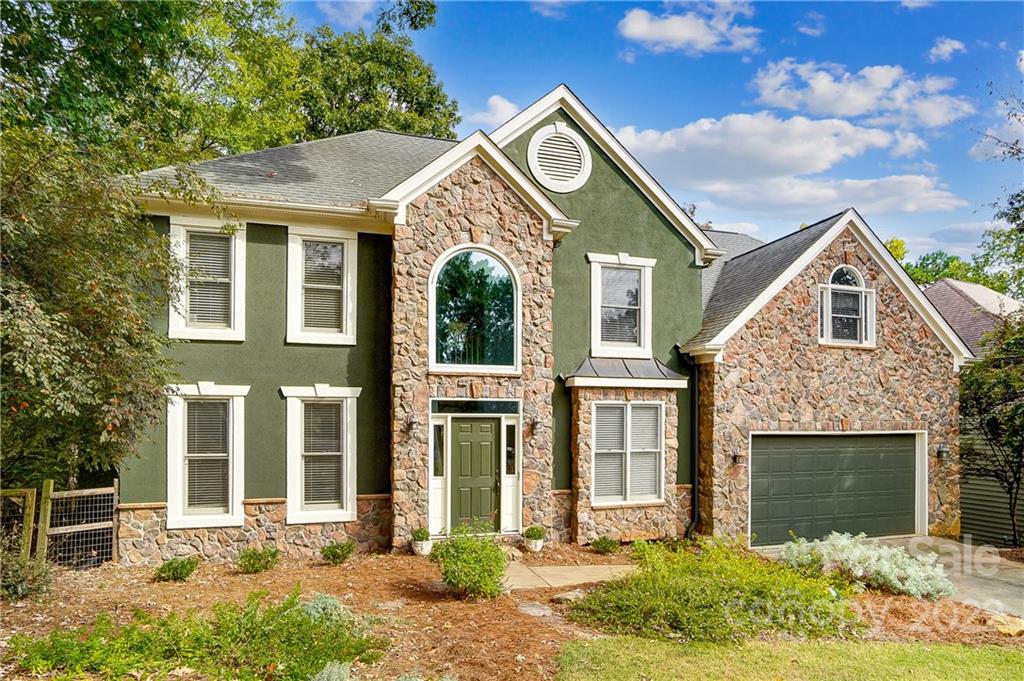 31020 Executive Point Tega Cay, SC 29708 - Photo 3 of 48 a front view of a house with garden