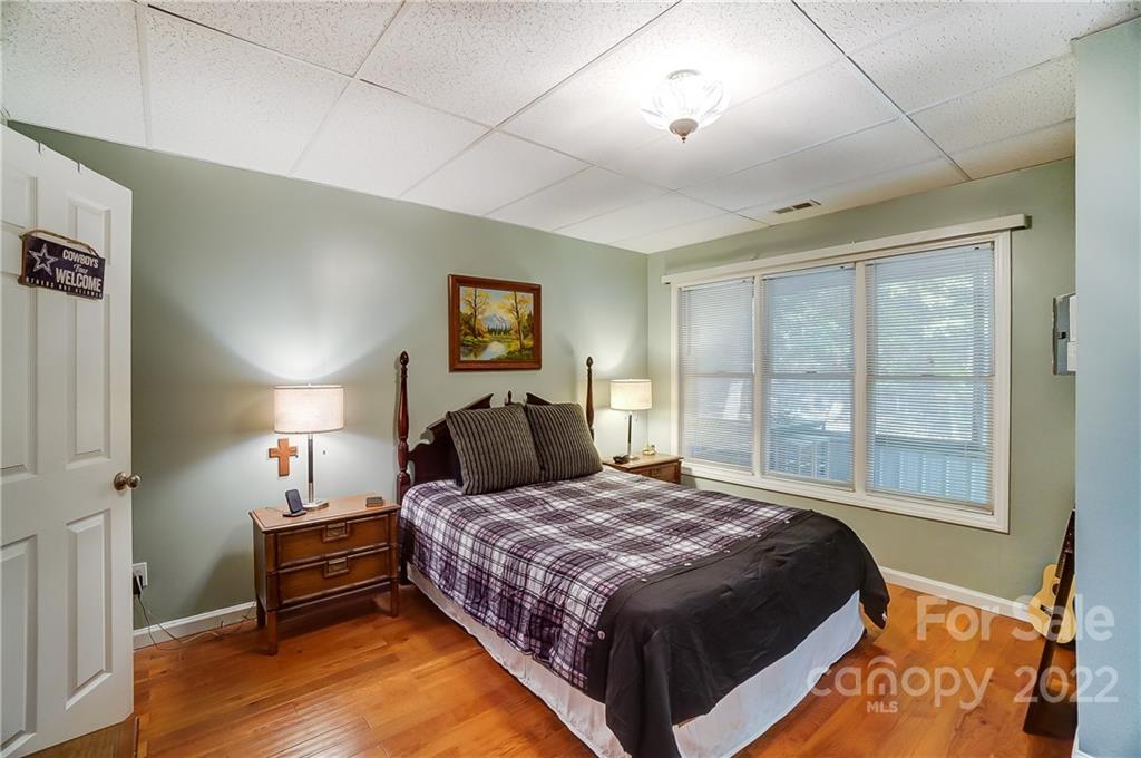 31020 Executive Point Tega Cay, SC 29708 - Photo 36 of 48 a bedroom with a bed and a night stand