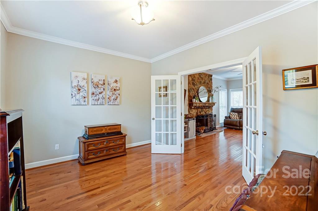 31020 Executive Point Tega Cay, SC 29708 - Photo 8 of 48 a living room with furniture and a wooden floor