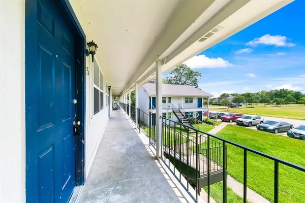 a view of a porch and garden