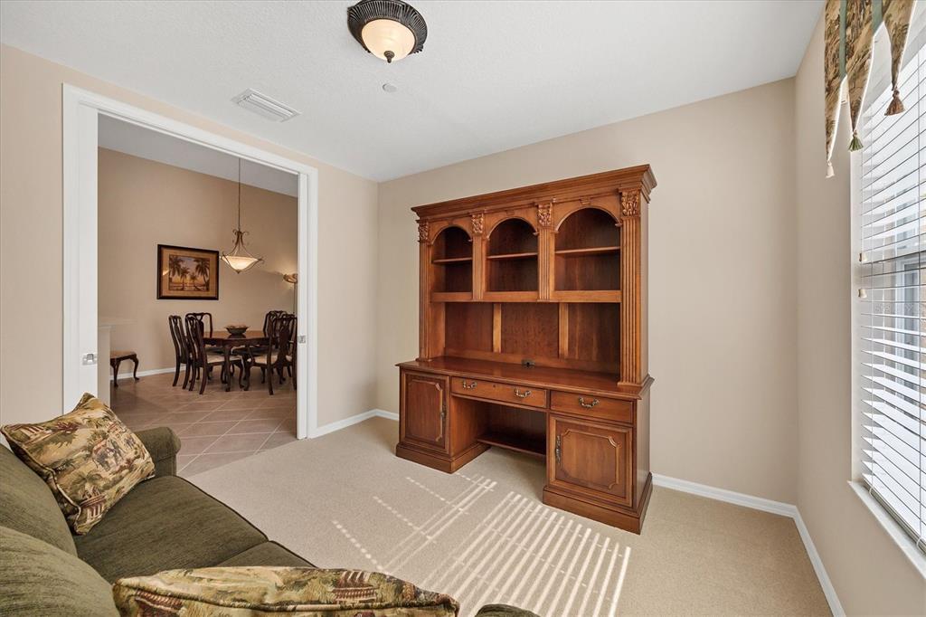 7115 Boca Grove Place, Unit 204 Lakewood Ranch, FL 34202 - Photo 17 of 40 a living room with furniture and a window