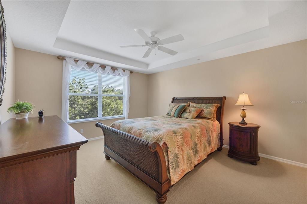 7115 Boca Grove Place, Unit 204 Lakewood Ranch, FL 34202 - Photo 18 of 40 a bedroom with a bed and window