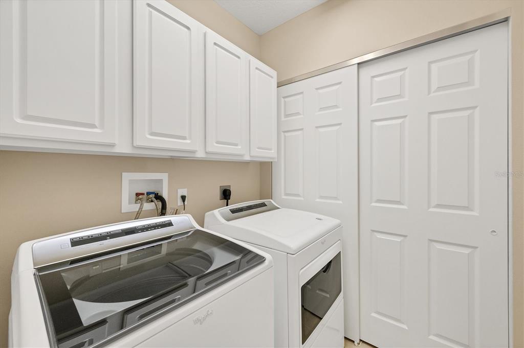 7115 Boca Grove Place, Unit 204 Lakewood Ranch, FL 34202 - Photo 23 of 40 a utility room with dryer and washer