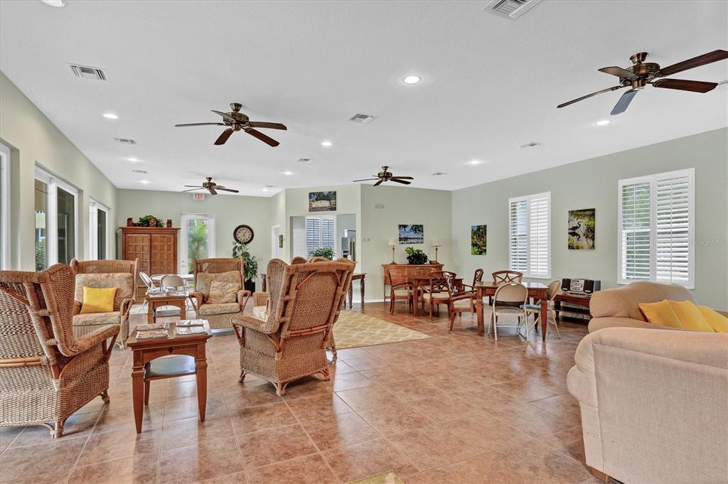 7115 Boca Grove Place, Unit 204 Lakewood Ranch, FL 34202 - Photo 30 of 40 a living room with furniture kitchen view and a window