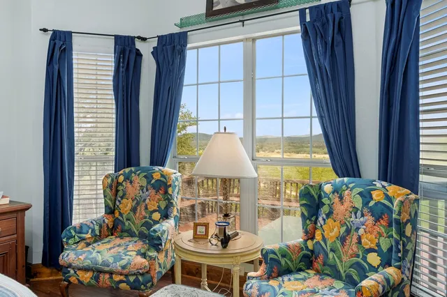 a living room filled with furniture and a table