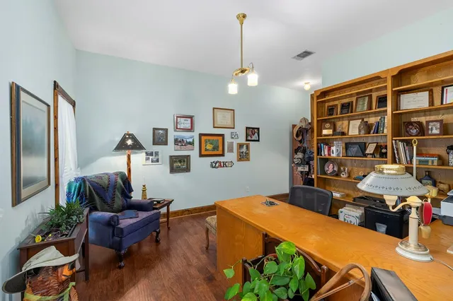 a view of a workspace with furniture