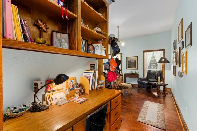 a room with furniture pool table and windows