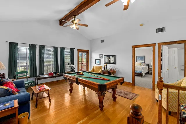 a bedroom with a bed and a couch