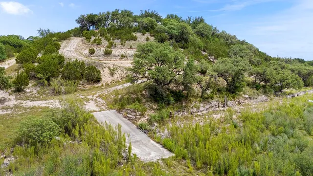 a view of a pathway with a yard