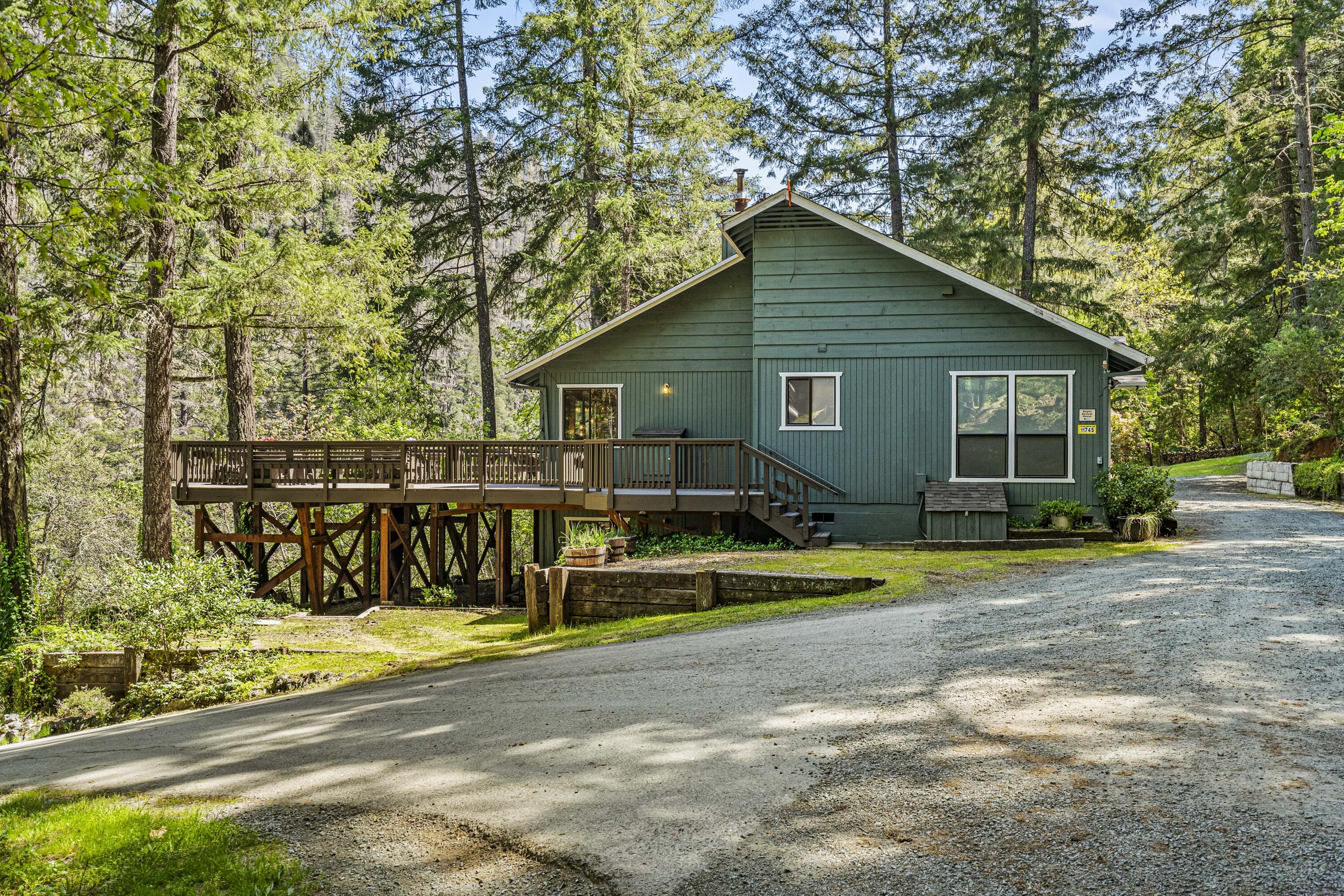 11744 Galice Road Merlin, OR 97532 - Photo 44 of 74 a view of a house with a yard and sitting area