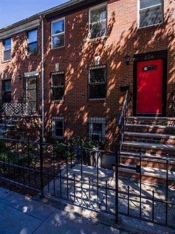 226 Christopher Columbus Drive, Unit 1 Jersey City, NJ 07302 - Photo 6 of 8 a view of a house with a brick wall