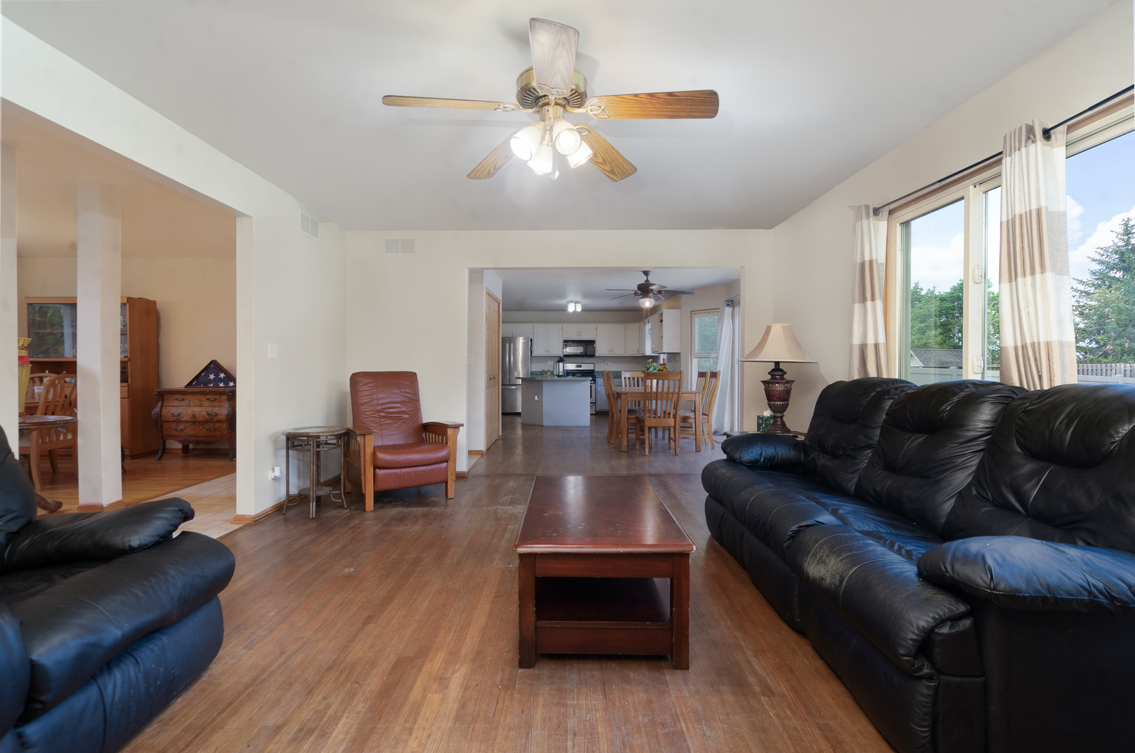 2104 Olde Mill Road Plainfield, IL 60586 - Photo 11 of 23 a living room with furniture and a wooden floor