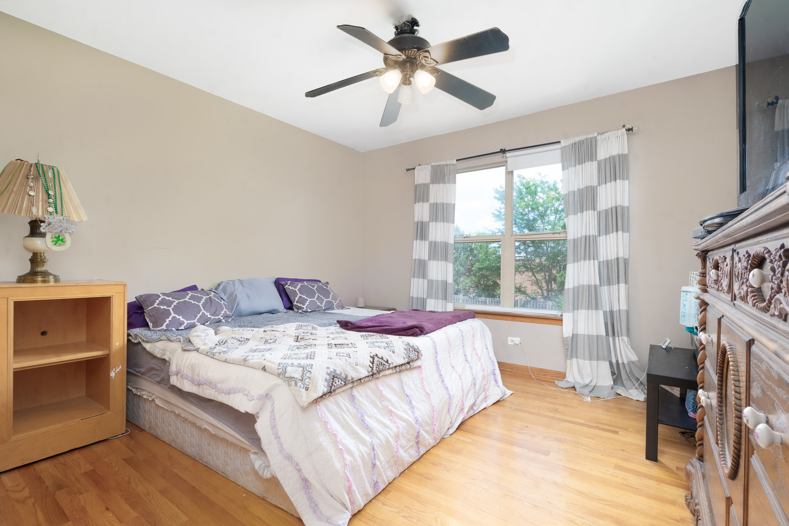 2104 Olde Mill Road Plainfield, IL 60586 - Photo 15 of 23 a bed sitting in a bedroom next to a window