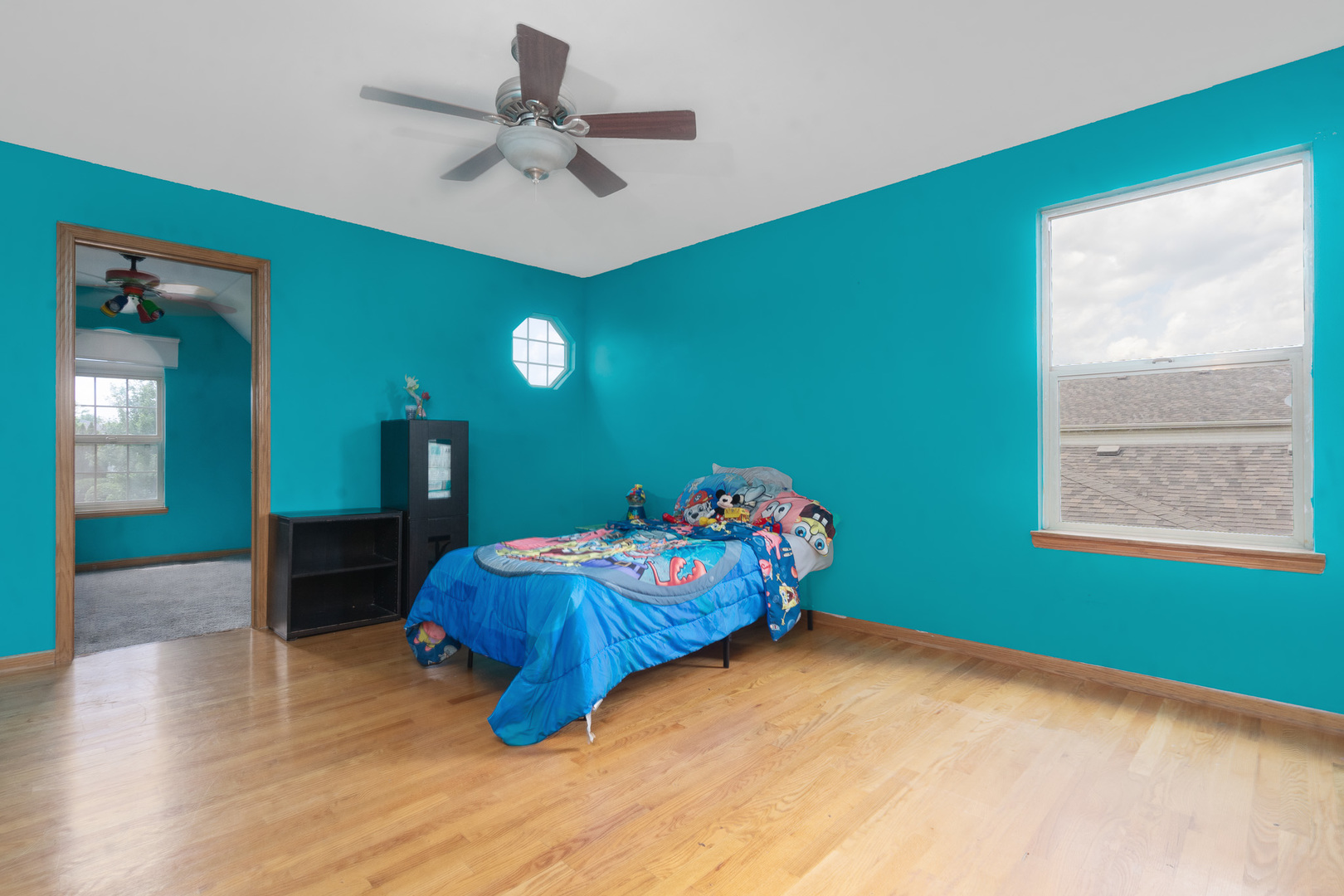 2104 Olde Mill Road Plainfield, IL 60586 - Photo 18 of 23 a bedroom with a bed and a chandelier