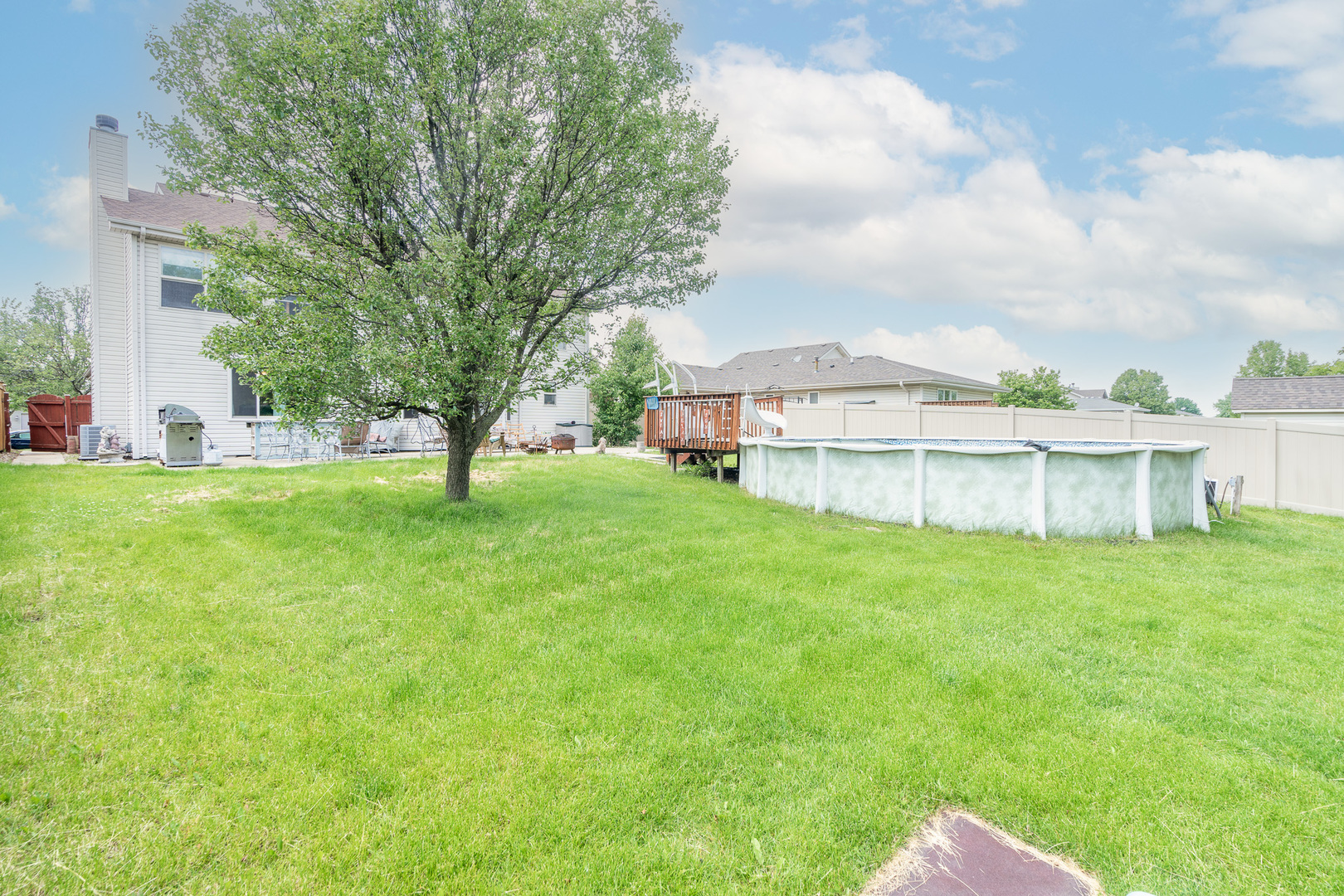 2104 Olde Mill Road Plainfield, IL 60586 - Photo 20 of 23 a view of a house with a big yard and large trees
