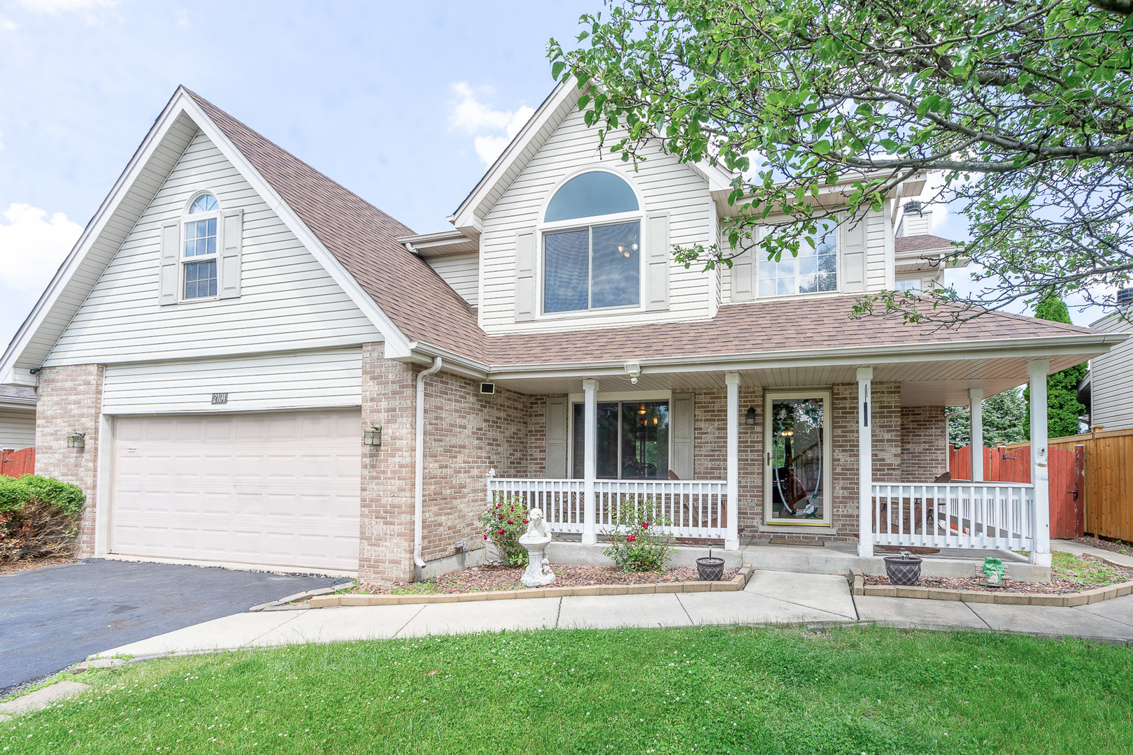 2104 Olde Mill Road Plainfield, IL 60586 - Photo 2 of 23 a view of a house with a yard and sitting area