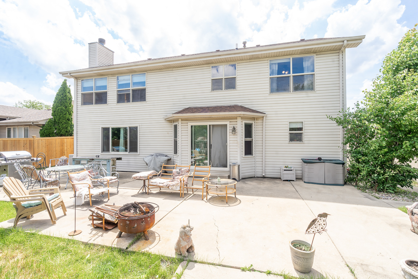 2104 Olde Mill Road Plainfield, IL 60586 - Photo 22 of 23 a view of a house with pool and chairs