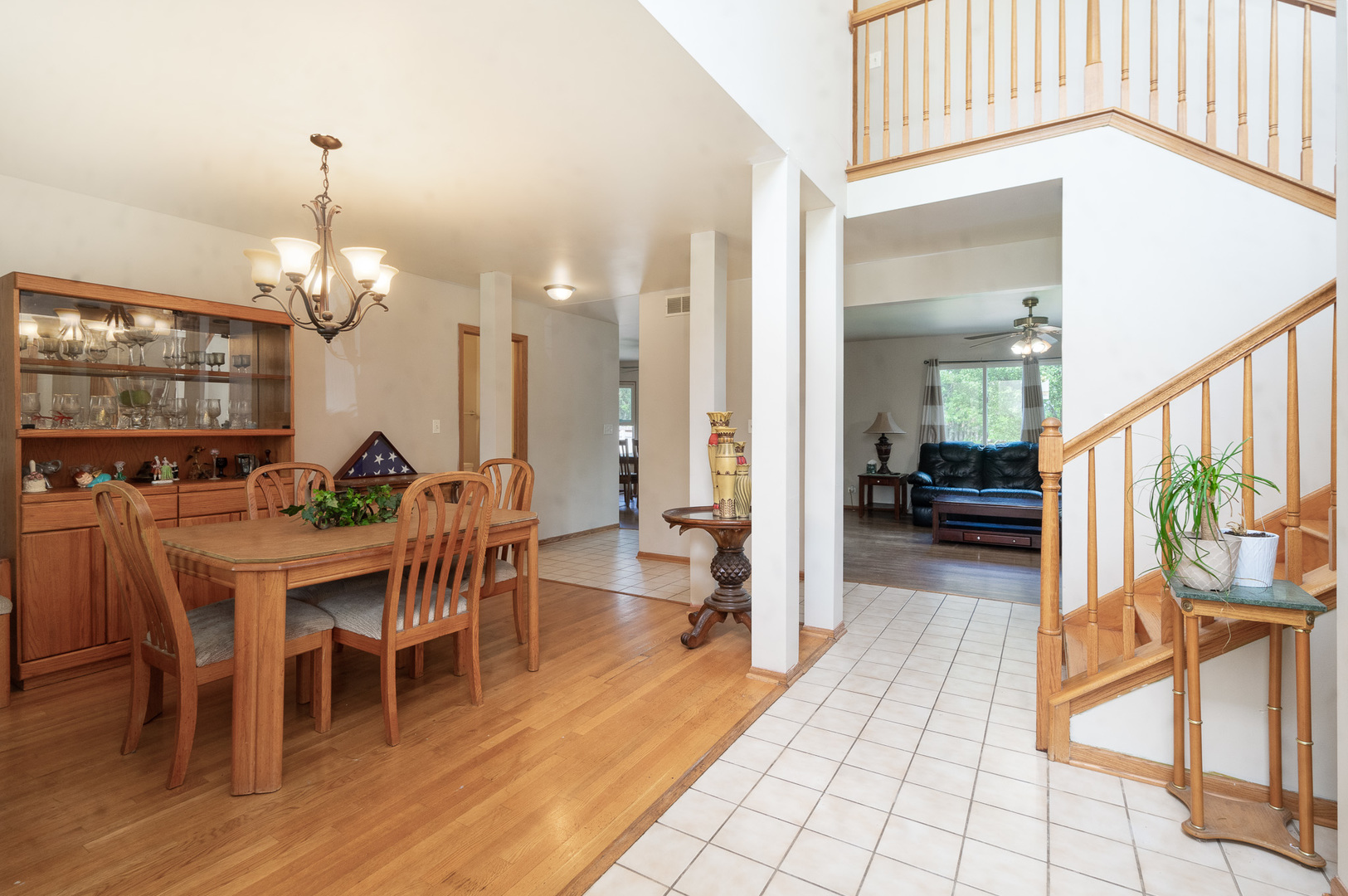 2104 Olde Mill Road Plainfield, IL 60586 - Photo 3 of 23 a view of a dining room with furniture and wooden floor
