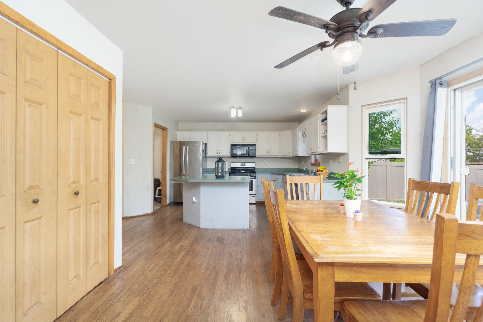 2104 Olde Mill Road Plainfield, IL 60586 - Photo 6 of 23 a dining room with furniture a window and wooden floor