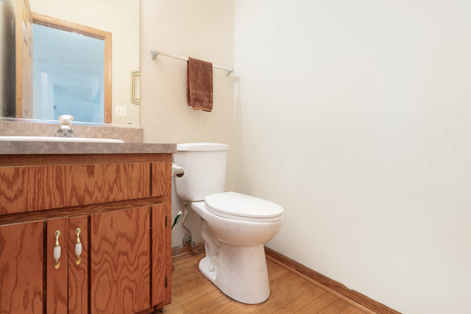 2104 Olde Mill Road Plainfield, IL 60586 - Photo 9 of 23 a bathroom with a toilet sink and mirror