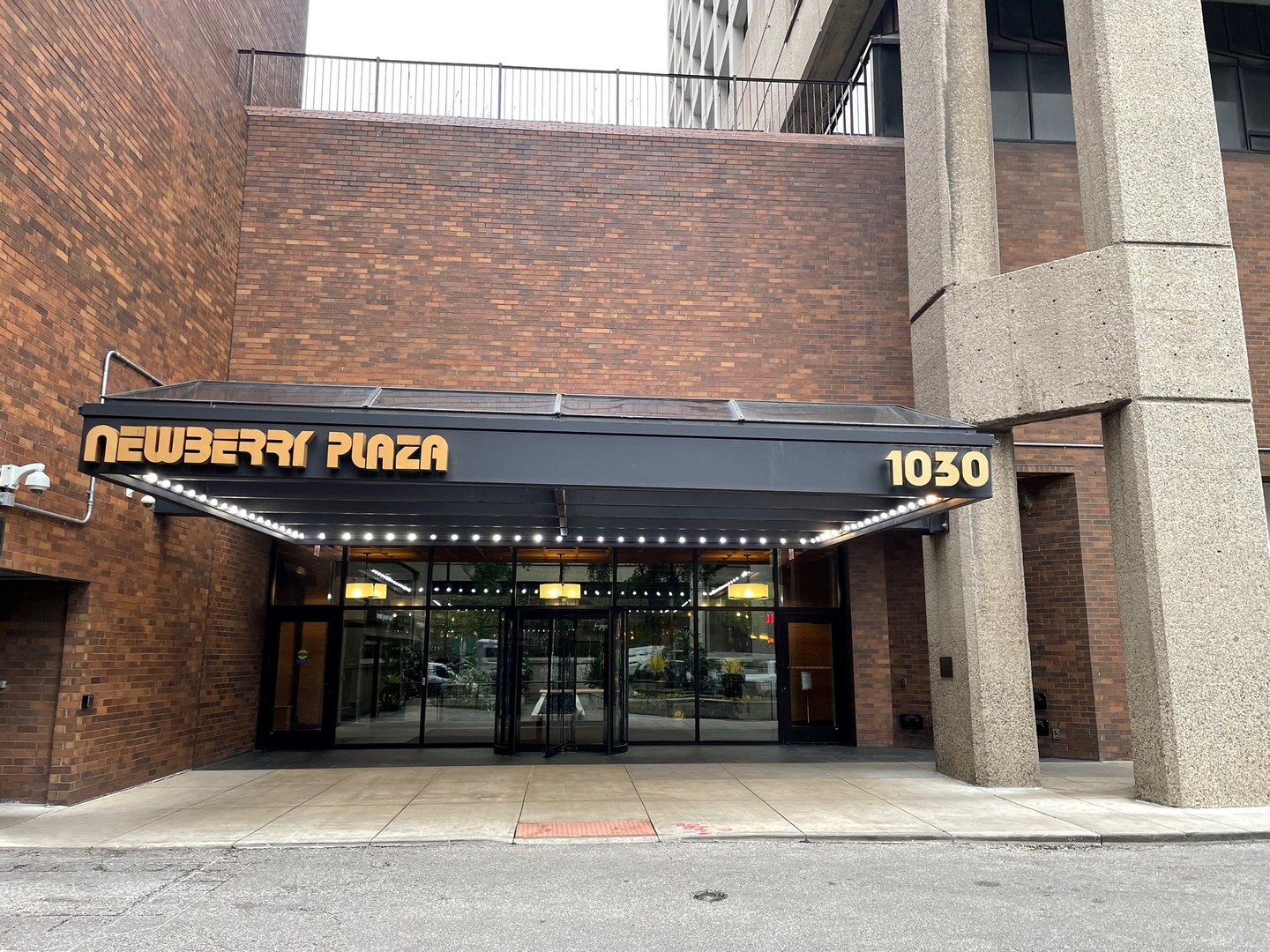 1030 North State Street, Unit 29M Chicago, IL 60610 - Photo 1 of 11 a view of a building with retail shops